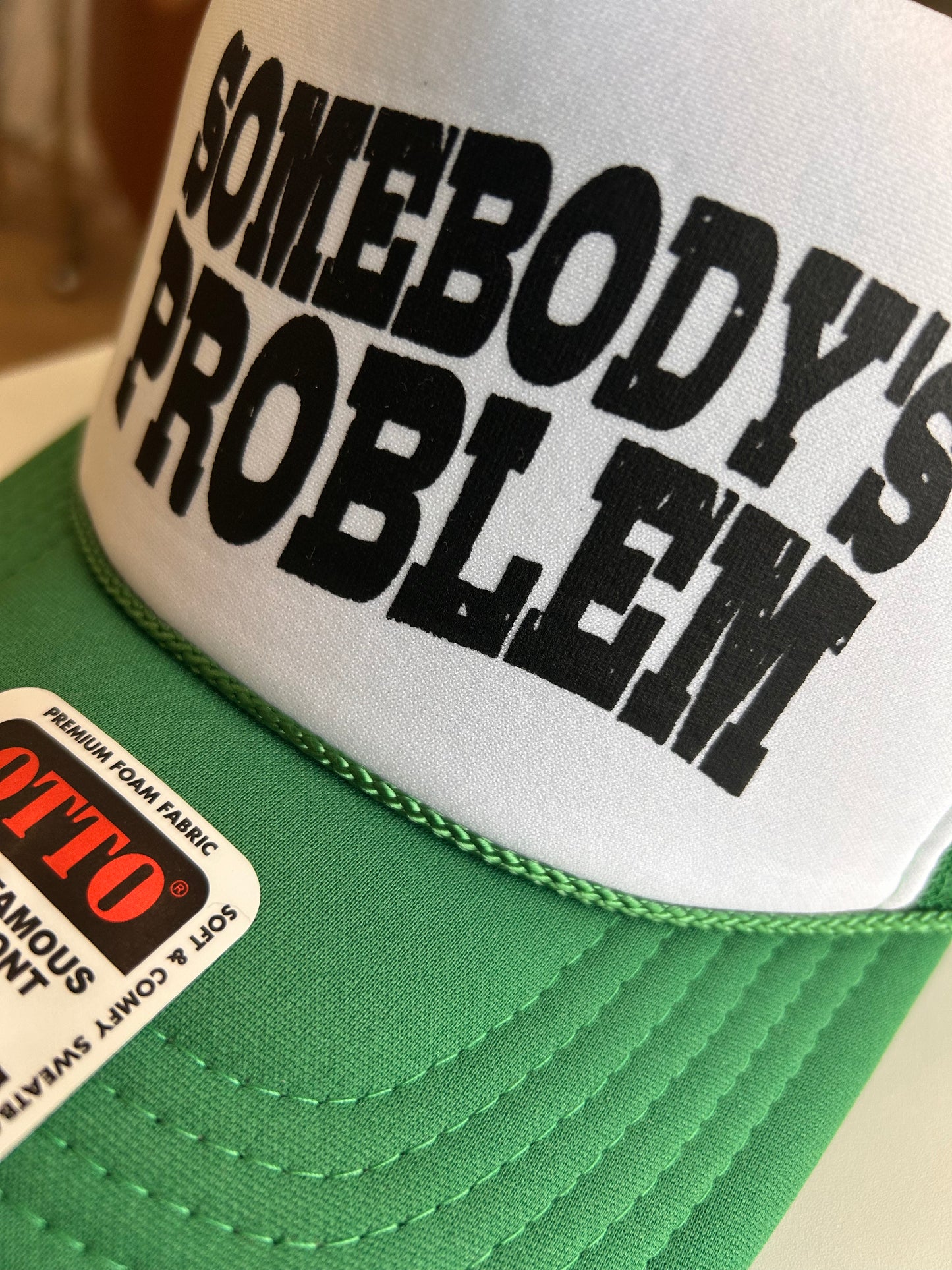 Somebody’s Problem Trucker Hat